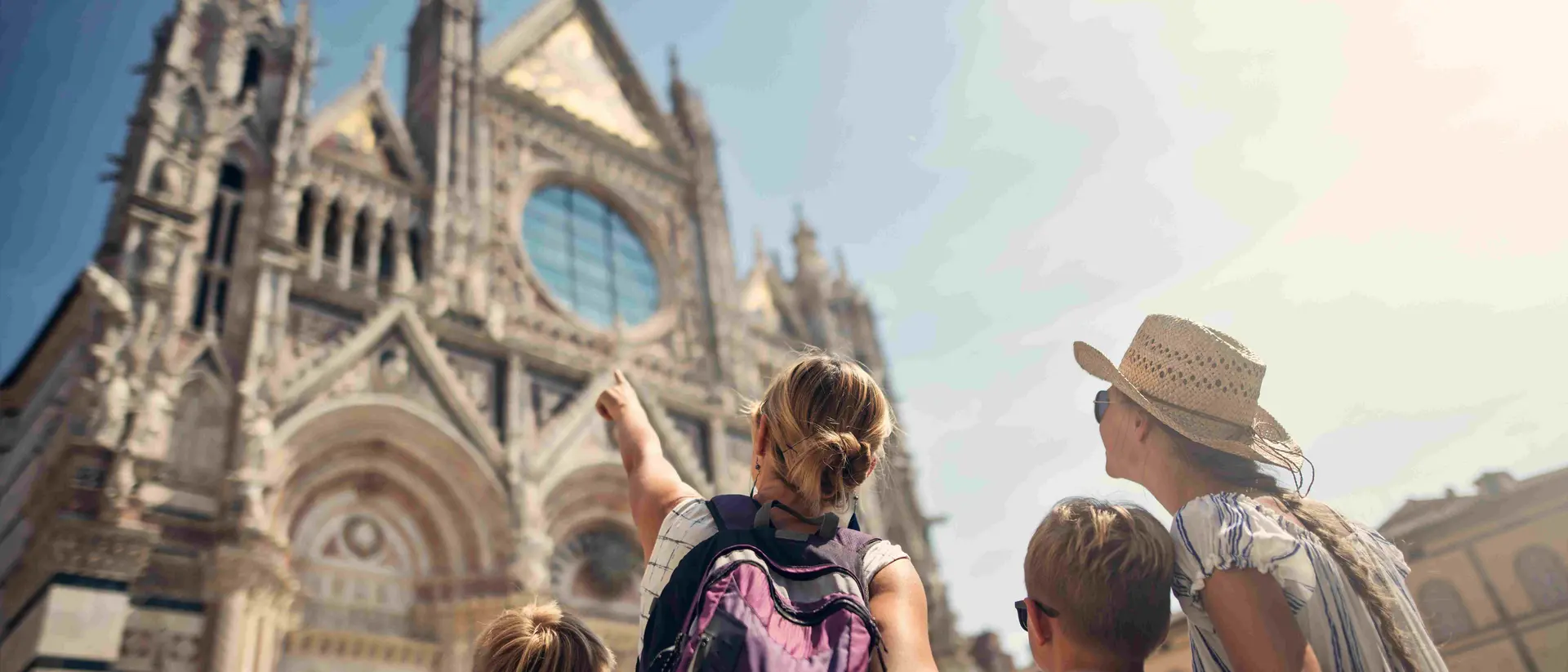 family looking at a cathedral in Italy