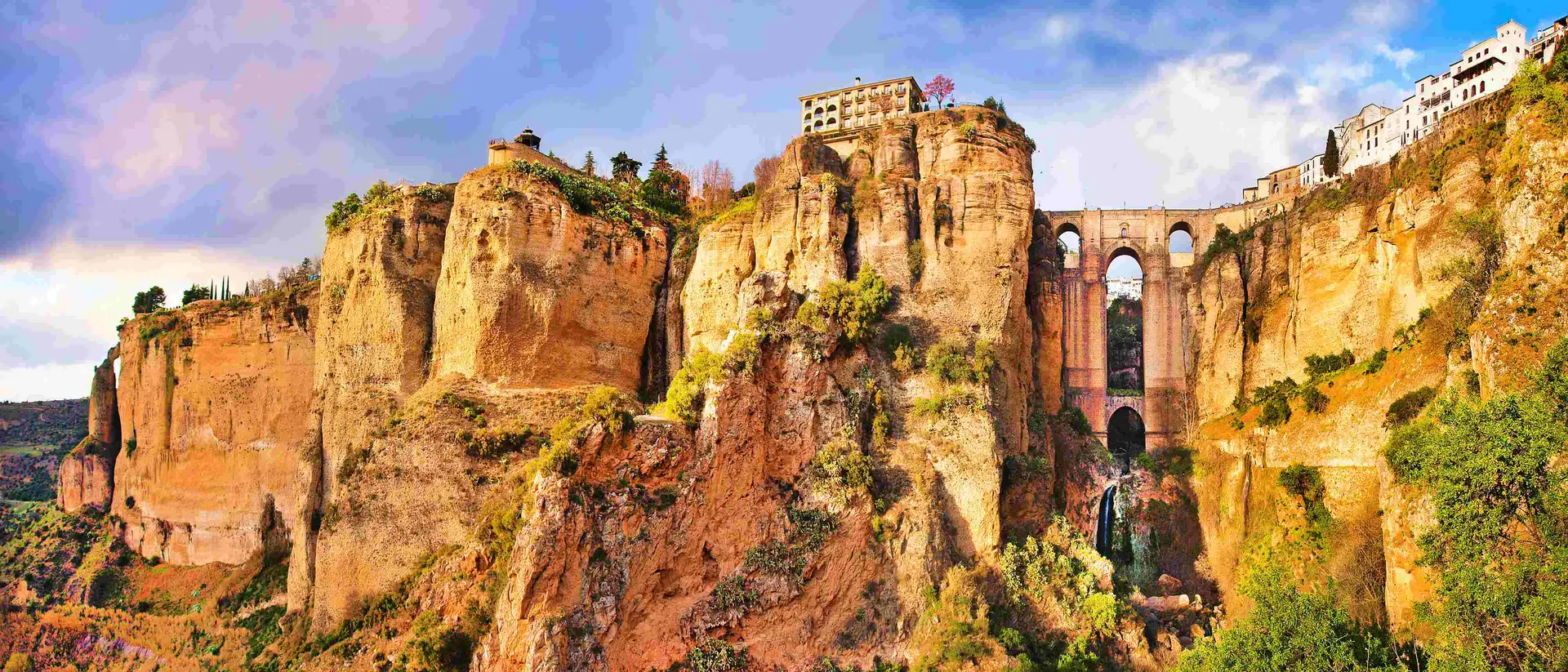 Panoramic view of the old city of Ronda, one of the famous white villages, at sunset in the province of Malaga, Andalusia, Spain