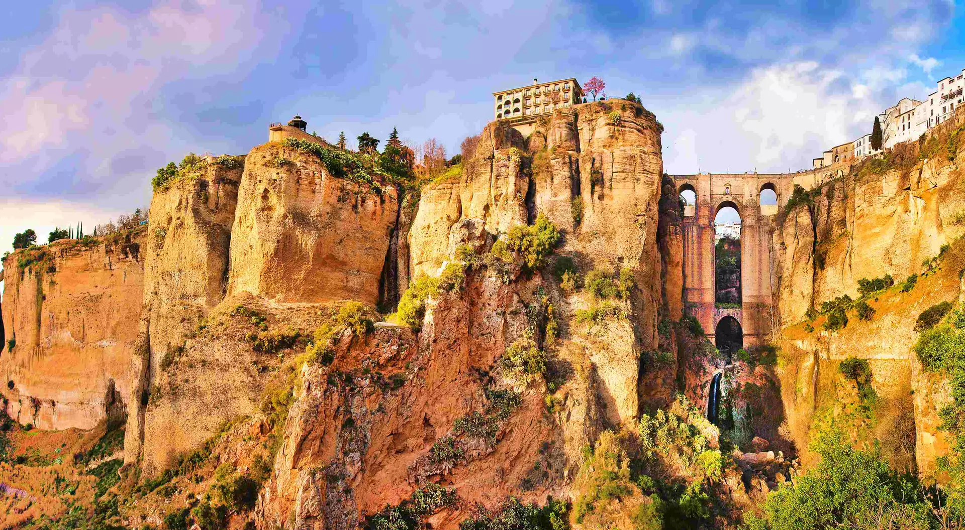 Panoramic view of the old city of Ronda, one of the famous white villages, at sunset in the province of Malaga, Andalusia, Spain
