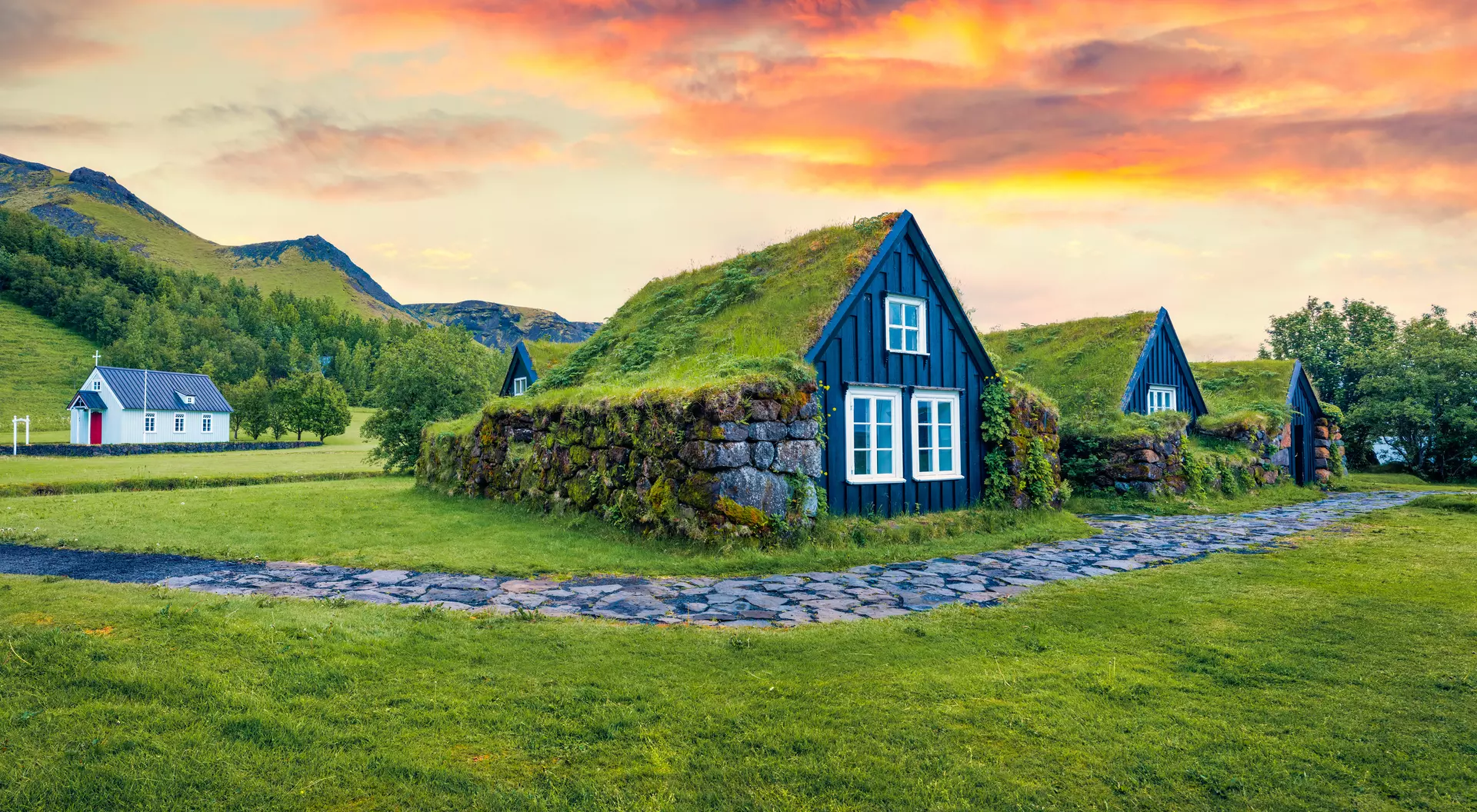 Typical view of turf-top houses in Icelandic countryside.