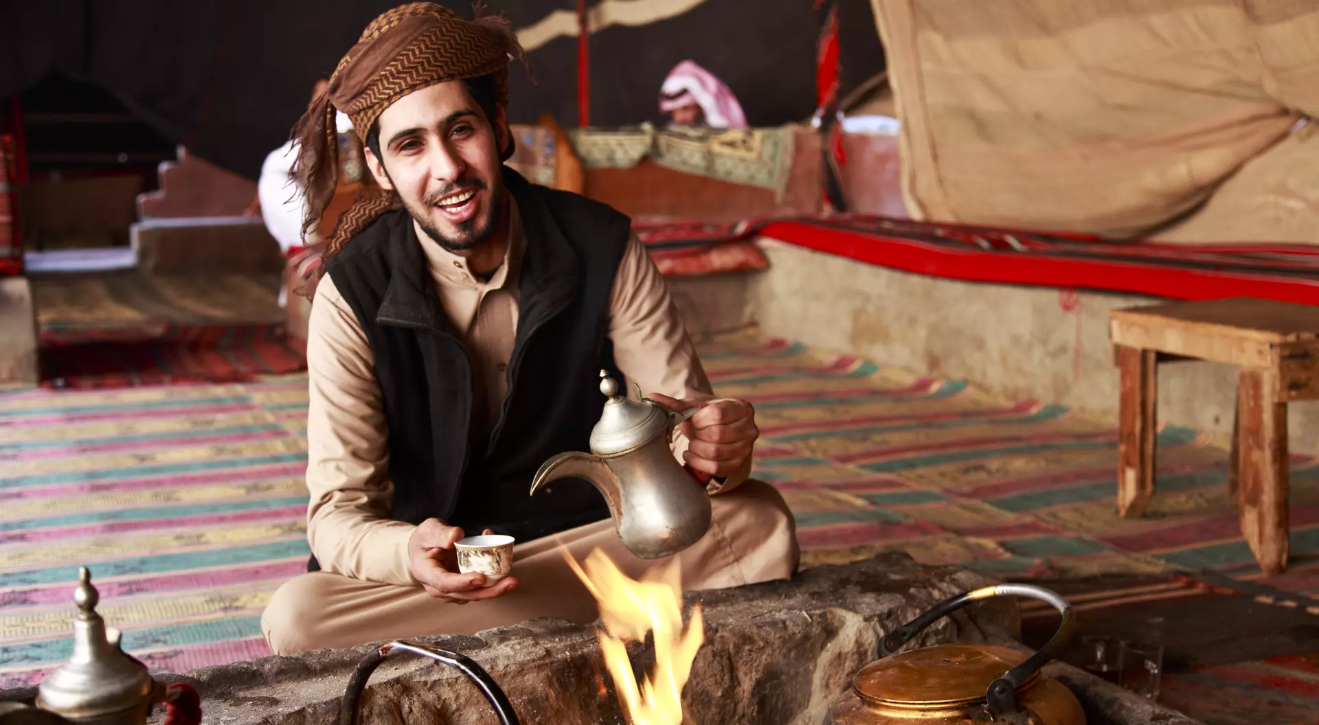 Bedouin man serving Arabic coffee