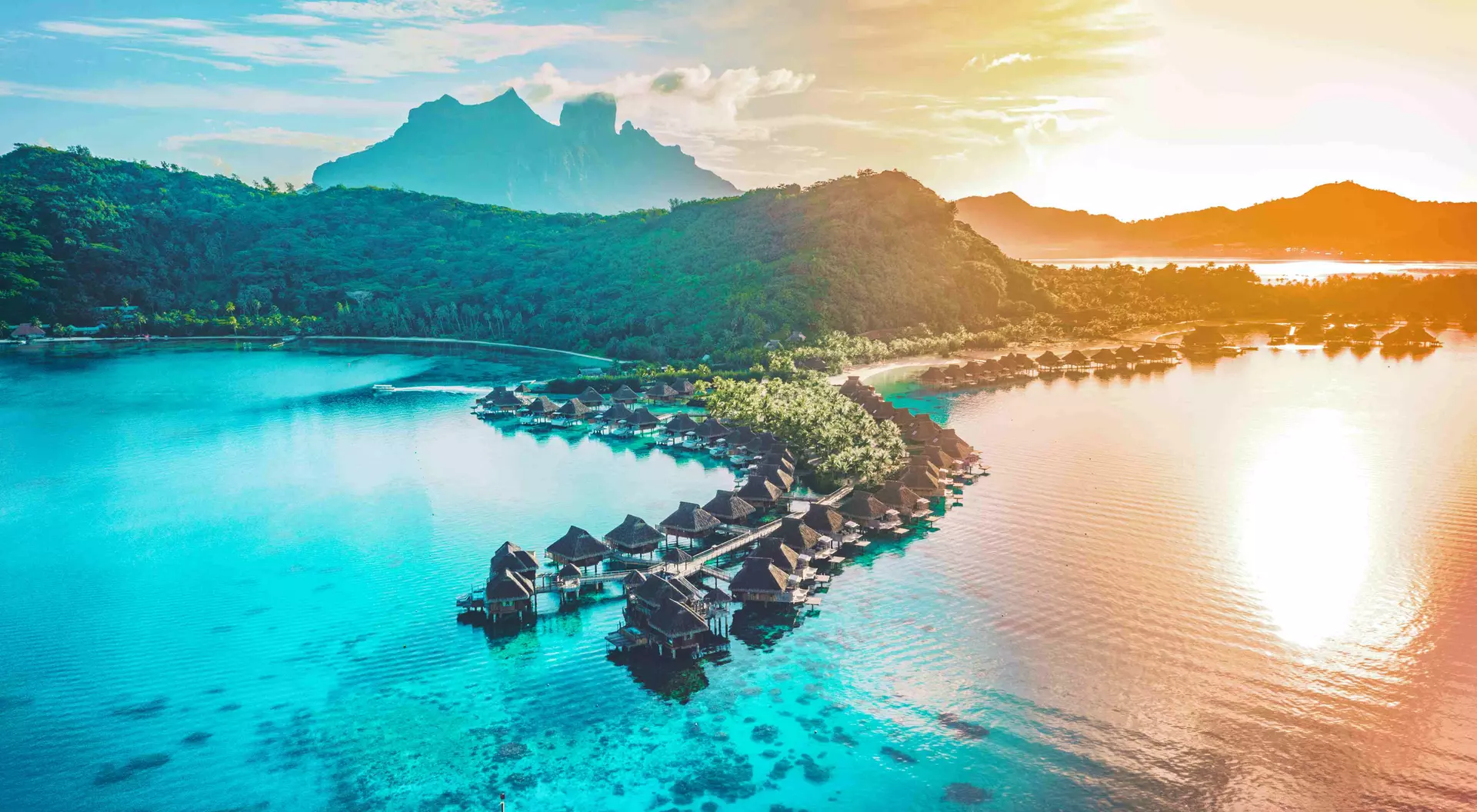 View from above at sunset of Bora Bora overwater bungalows, French Polynesia, Tahiti.