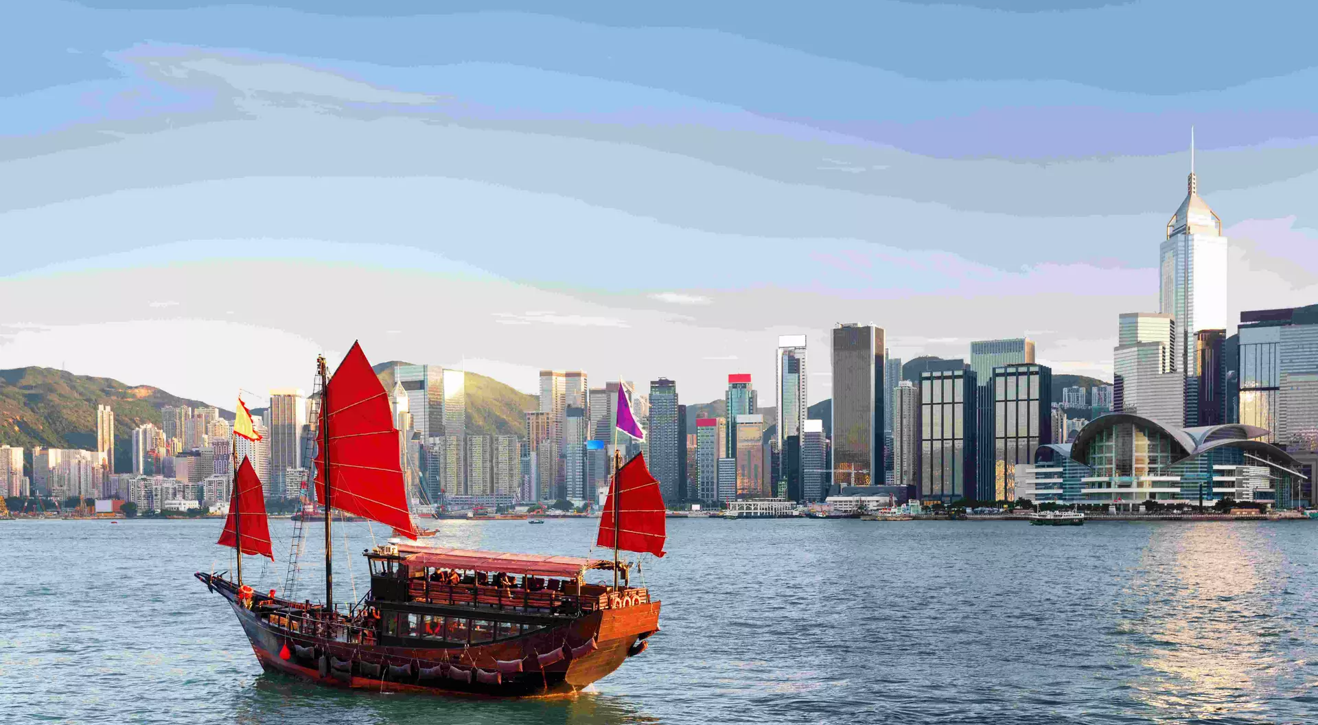 Scenic view of a traditional Chinese junk in Victoria harbor, Hong Kong.