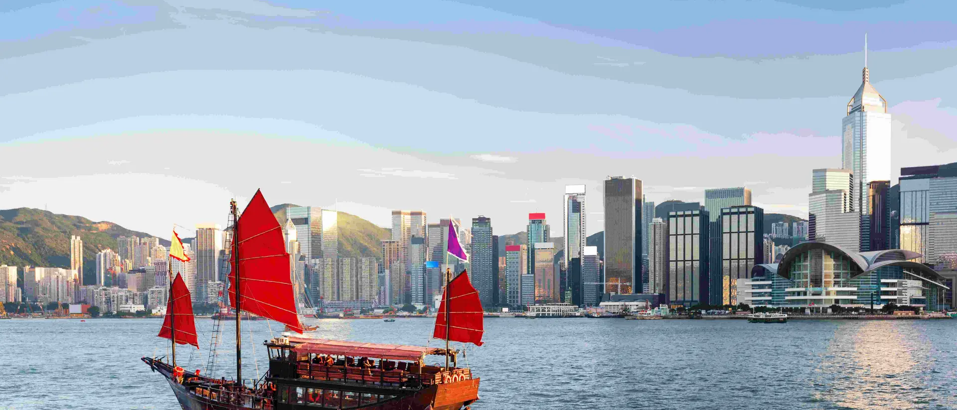 Scenic view of a traditional Chinese junk in Victoria harbor, Hong Kong.