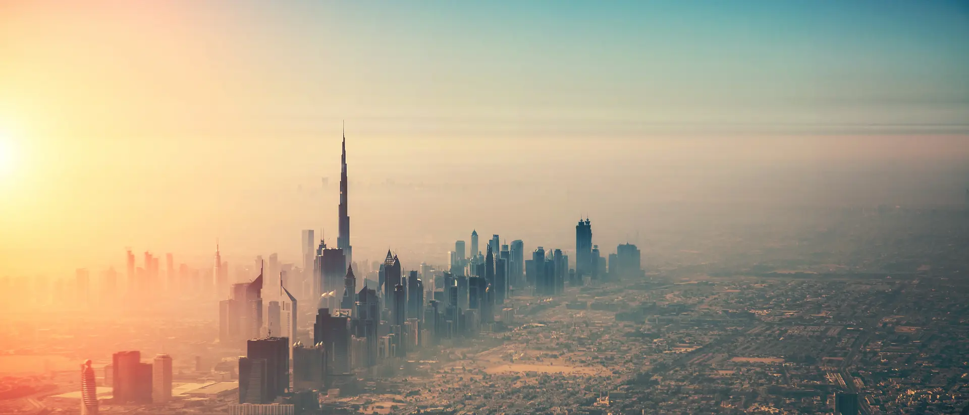aerial view of city skyline draped in mist