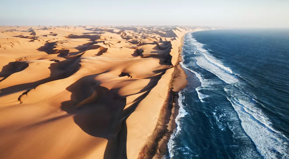 Aerial photo of where the Namib desert and the Atlantic ocean