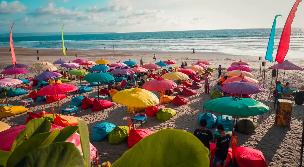 Colourful beach umbrellas with view of Double Six Beach, Seminyak, Bali, Indonesia