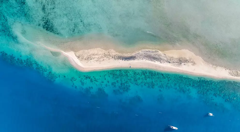 High angle aerial drone view of the sandbar and blue waters