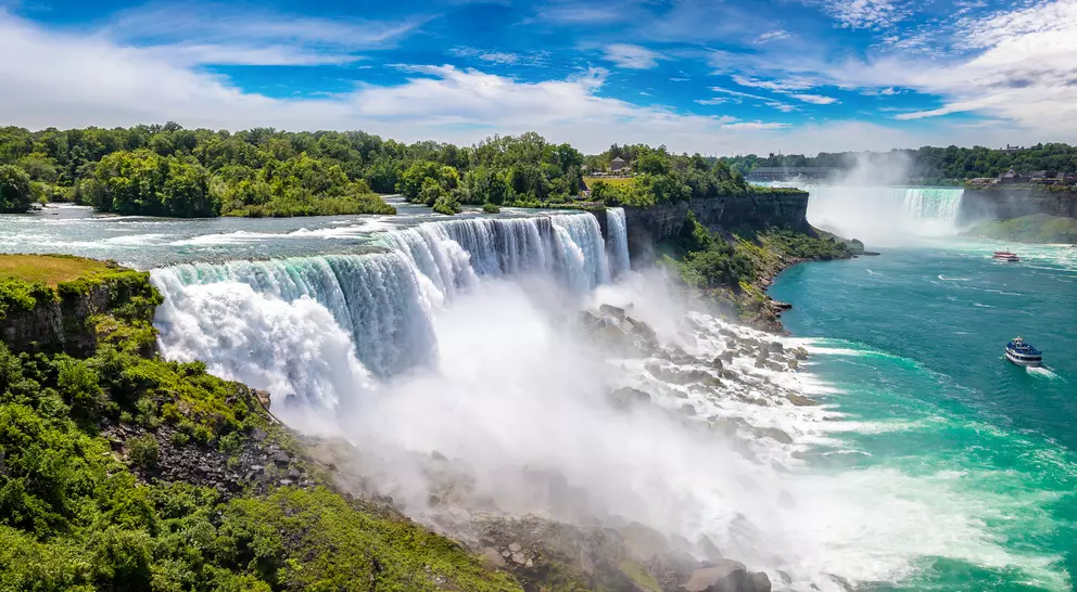 Close-up of the majectic American Falls pouring into the Niagara River with the horseshoe falls in the background
