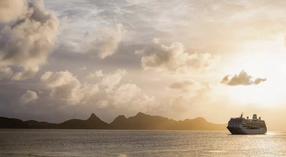 Cruise ship moored off Mayreau Island, one of the Grenadines. The island in the background is Union Island.