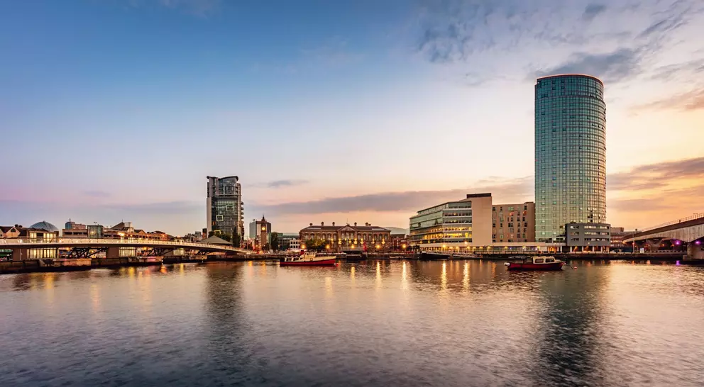 Panorama of Belfast River Lagan Waterfront Cityscape and Lagan Bridge at Sunset Twilight