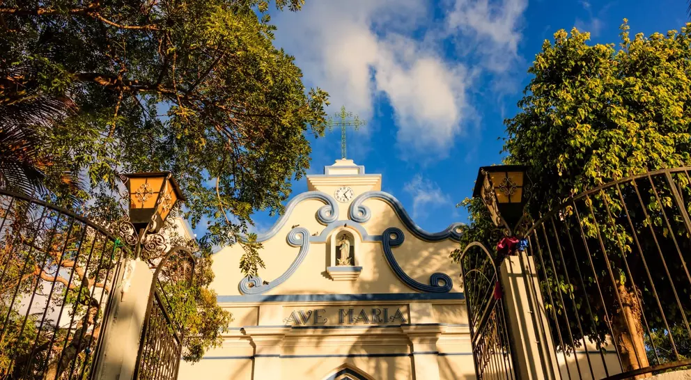 Sun shining over a small village colonial cathedral in El Salvador, Central America