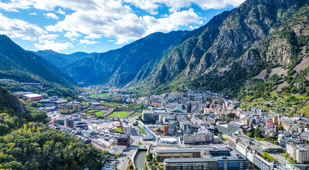 Expansive aerial view revealing the dense urban landscape nestled among the mountains of Andorra