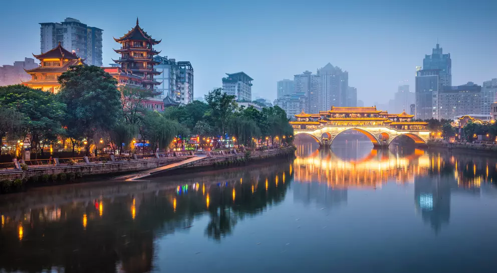 river with bridge and pagoda in background