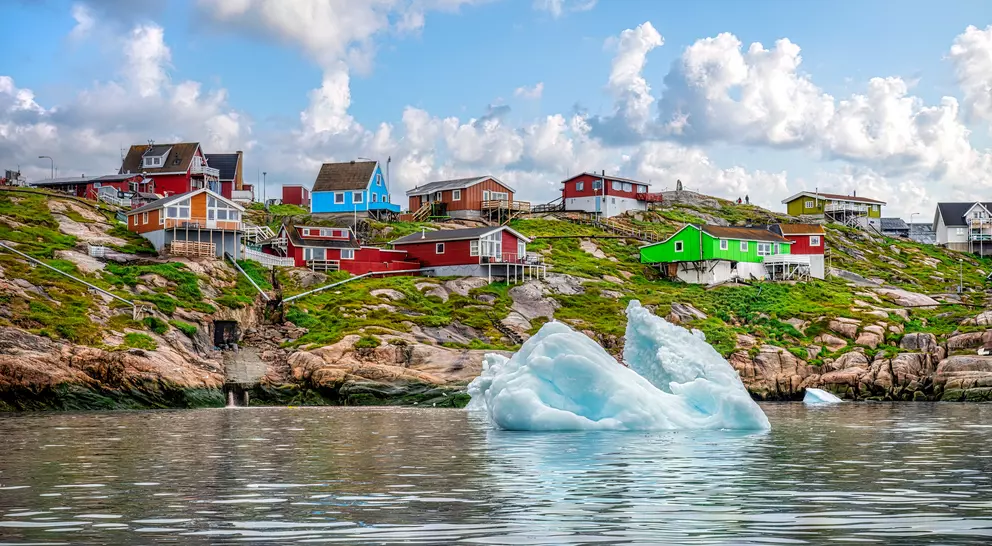 An iceberg floats in the water off the coast of Ilulissat in Greenland in summer