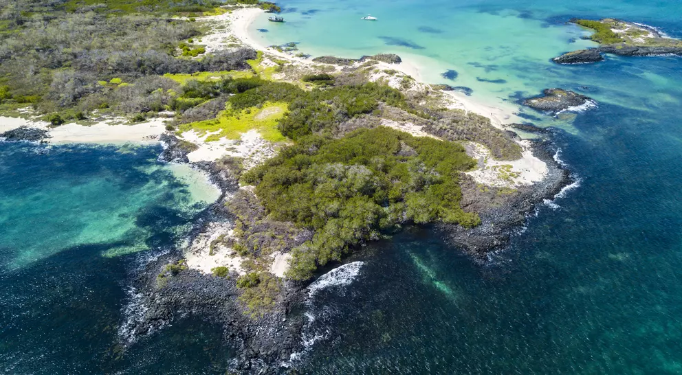 Aerial view of the sandy Cerro Brujo Beach at the north western coast of San Cristobal Island, Galapagos, Ecuador.