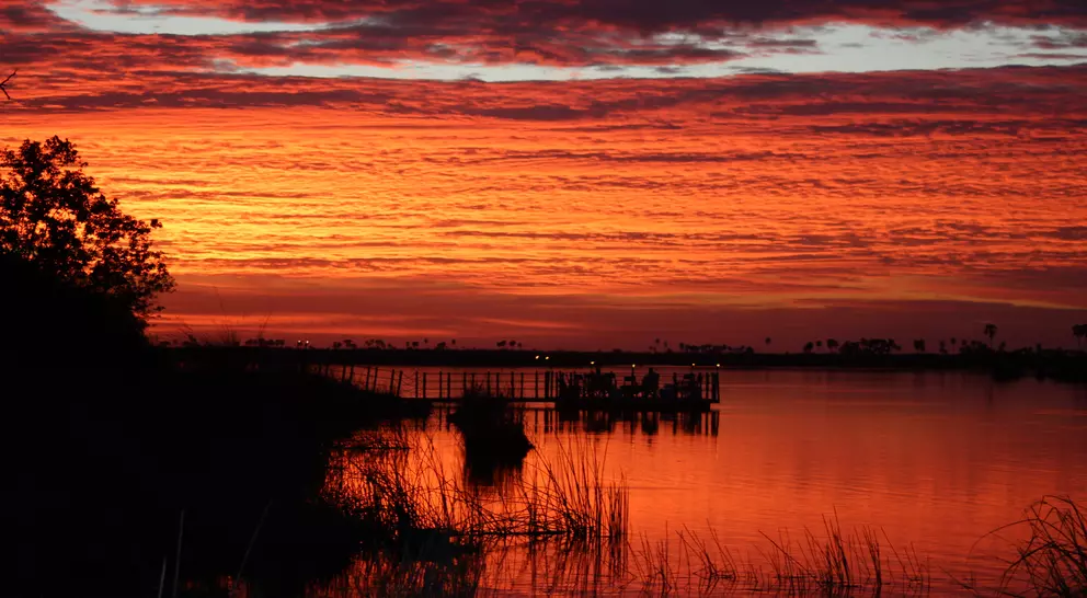 Sunset over river at wildlife reserve