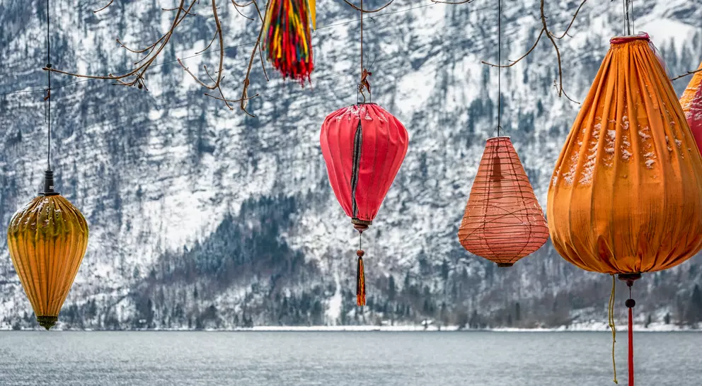 Scenic picture-postcard view of famous Hallstatt mountain village in the Austrian Alps at beautiful light in winter, Salzkammergut region