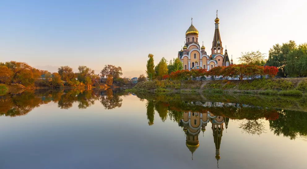 Russian orthodox church and its reflection, at the sunset in Almaty, Kazakhstan