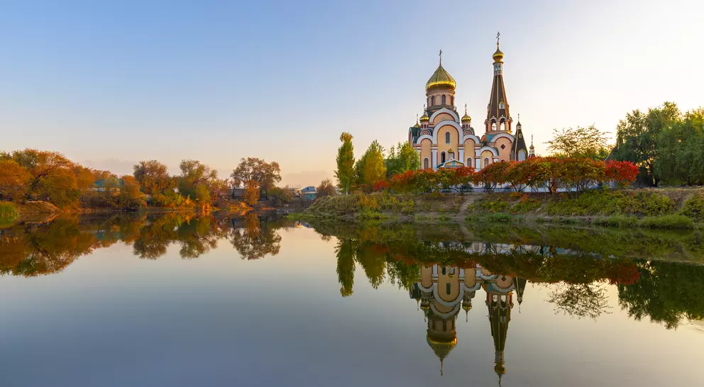 Russian orthodox church and its reflection, at the sunset in Almaty, Kazakhstan
