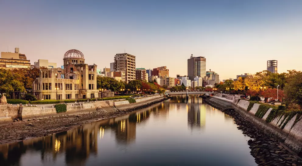 Panorama of Hiroshima Cityscape at Twilight. View over the Ota River, Atomic Bomb Dome illuminated on the left side of the river