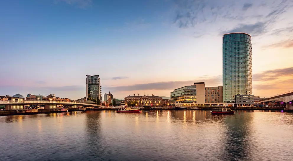 Panorama of Belfast River Lagan Waterfront Cityscape and Lagan Bridge at Sunset Twilight