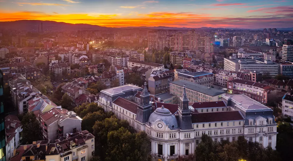 Panoramic high angle view above Western city of Sofia, Bulgaria, Eastern Europe during sunset back light into the sky