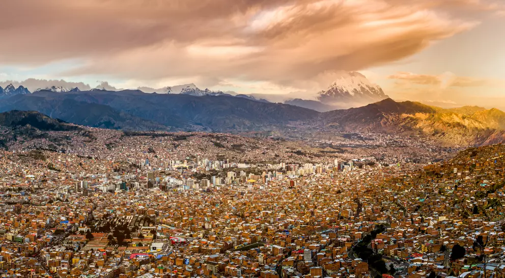 Panoramic view of La Paz, Bolivia, during sunset with Illimani Mountain rising in the background