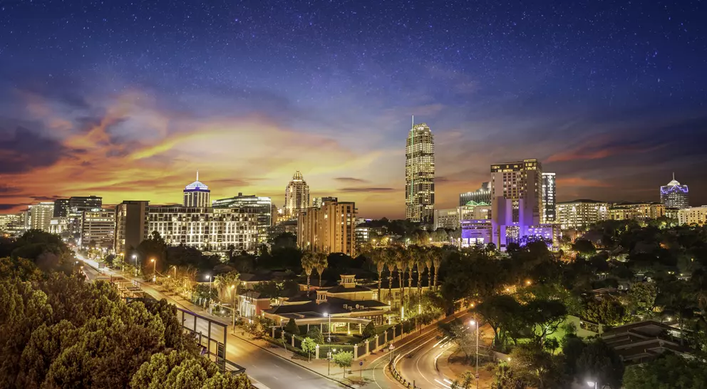 Sandton city at night with twilight and stars in the sky, Gauteng Johannesburg