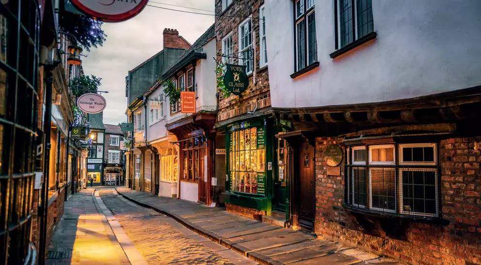 The Shambles, a medieval street preserved in the heart of the English city of York, still busy with boutique shops and cafes