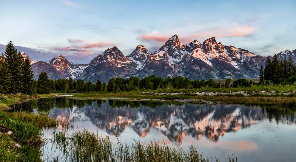 Reflections of Grand Teton Mountain reflecting in the water