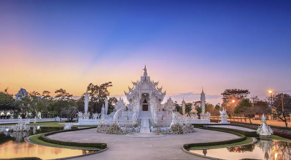 Evening view of Wat Rong Khun or White Temple in Chiang Rai, Thailand