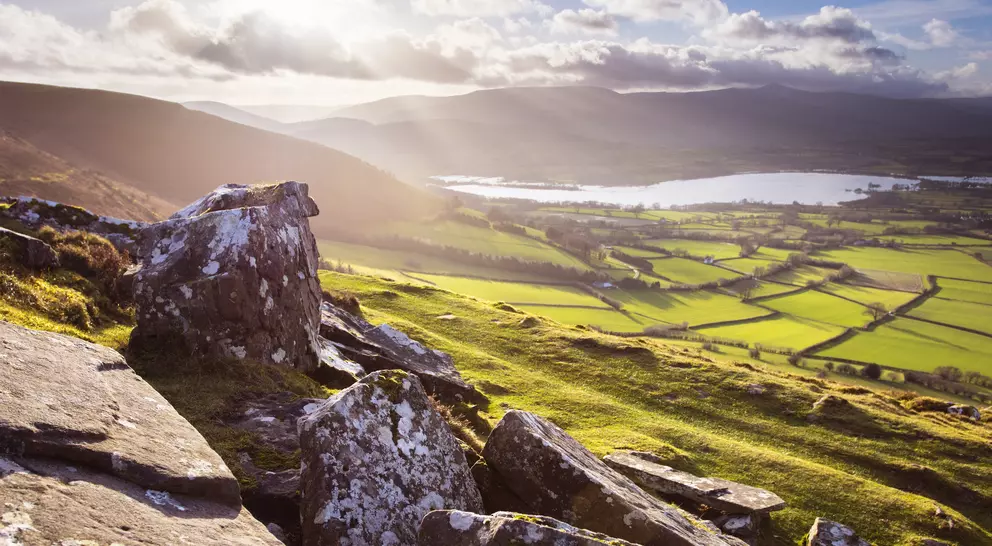 Mountain region featuring valley farms and river