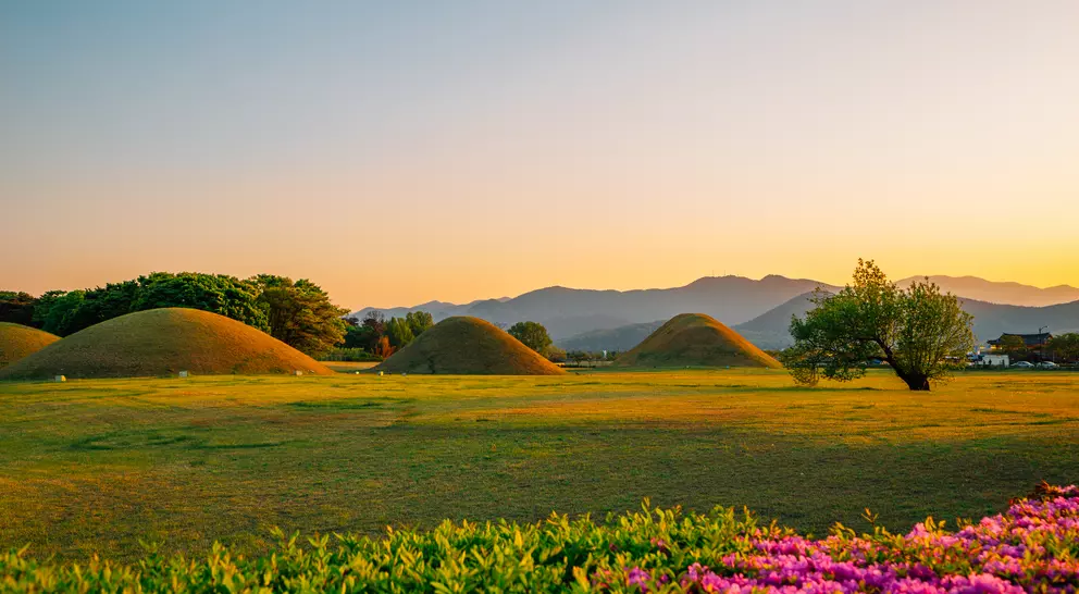 Sunset view of Gyeongju Daereungwon Tomb Complex grass mounds in Gyeongju, Korea