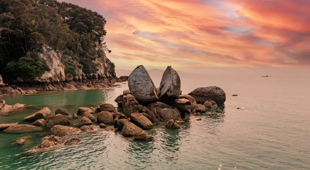 Famous rock and tourist site in national park with sunset in the background