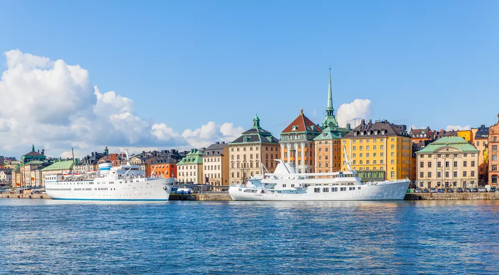 Panoramic view of waterfront with moored ships in the Old Town (Gamla stan)
