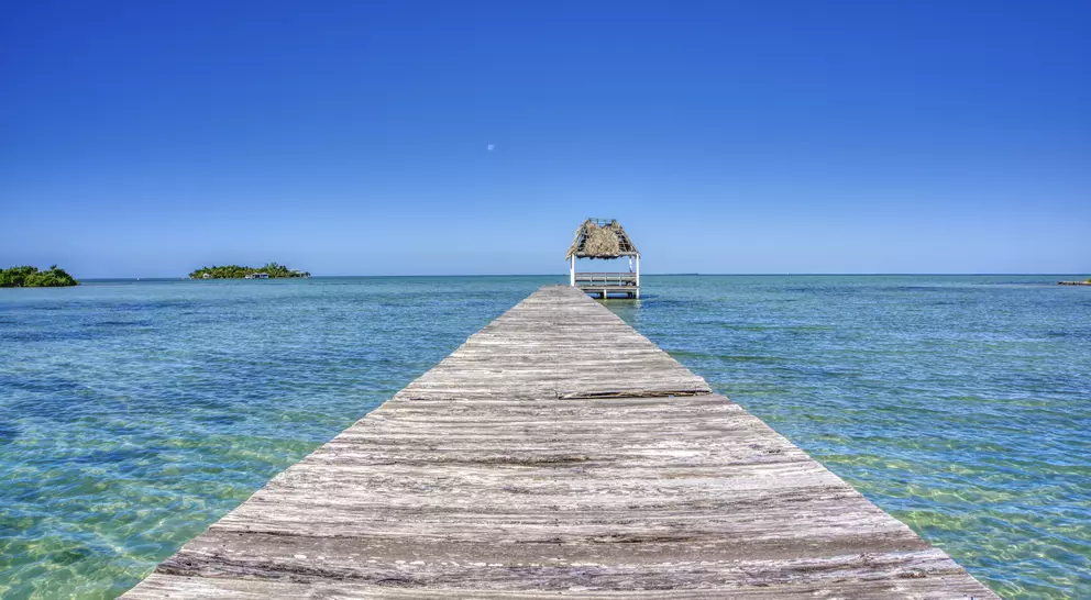 Pier over the blue sea on San Pedro Island in the Caribbean nation of Belize