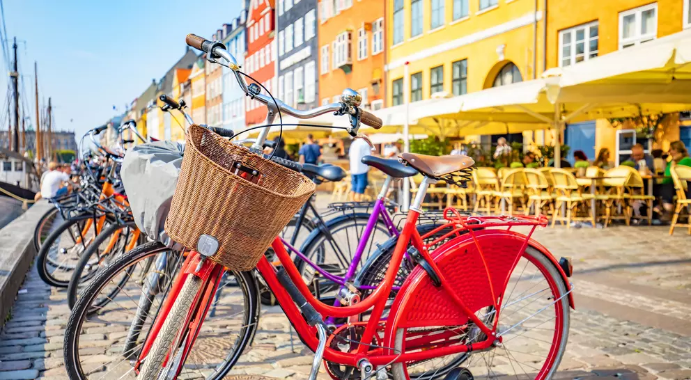 Scenic view of Copenhagen old town, Nyhavn harbor, selective focus on a front bicycle