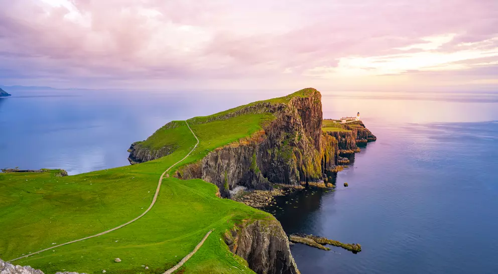Lightouse at edge of cliff overlooking atlantic ocean