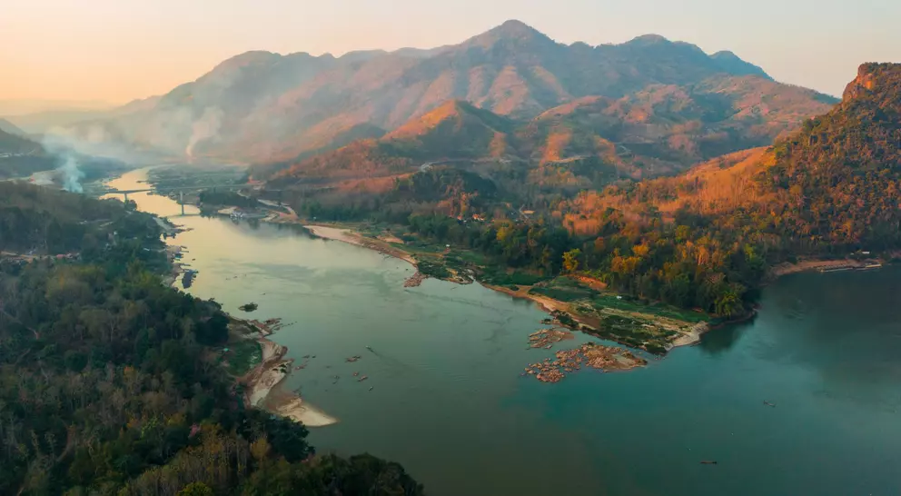 Aerial view of tranquil scene of river at sunset