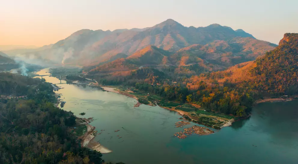 Aerial view of tranquil scene of river at sunset