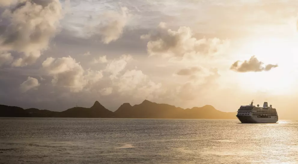 Cruise ship moored off Mayreau Island, one of the Grenadines. The island in the background is Union Island.