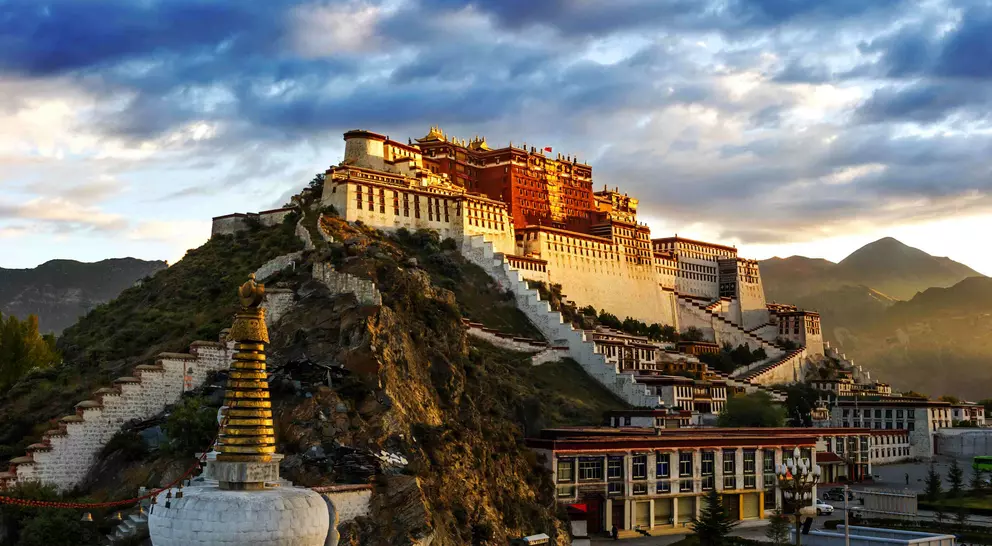 The red and white Potala Palace, is built on Red Mountain in the centre of Lhasa Valley and is the winter palace of the Dalai Lama