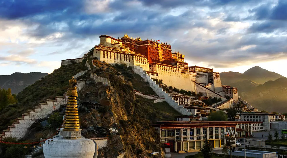 The red and white Potala Palace, is built on Red Mountain in the centre of Lhasa Valley and is the winter palace of the Dalai Lama