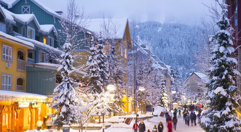 Stunning pedestrian village blanketed with fresh snow at dusk at twilight
