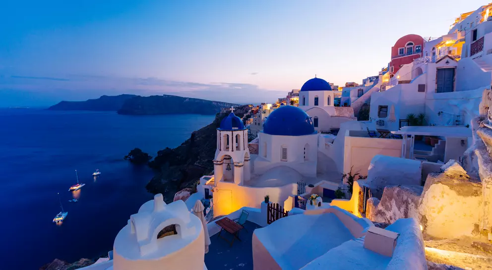 Famous Oia blue dome churches at twilight