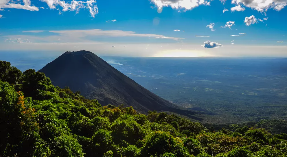 View of volcano with lush hungles and horizon