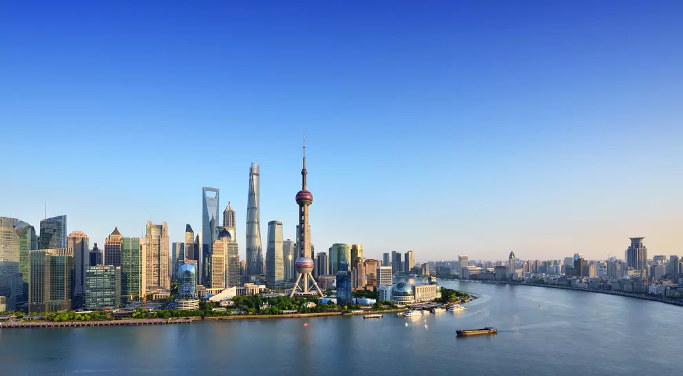 Shanghai skyline in blue sky at sunset