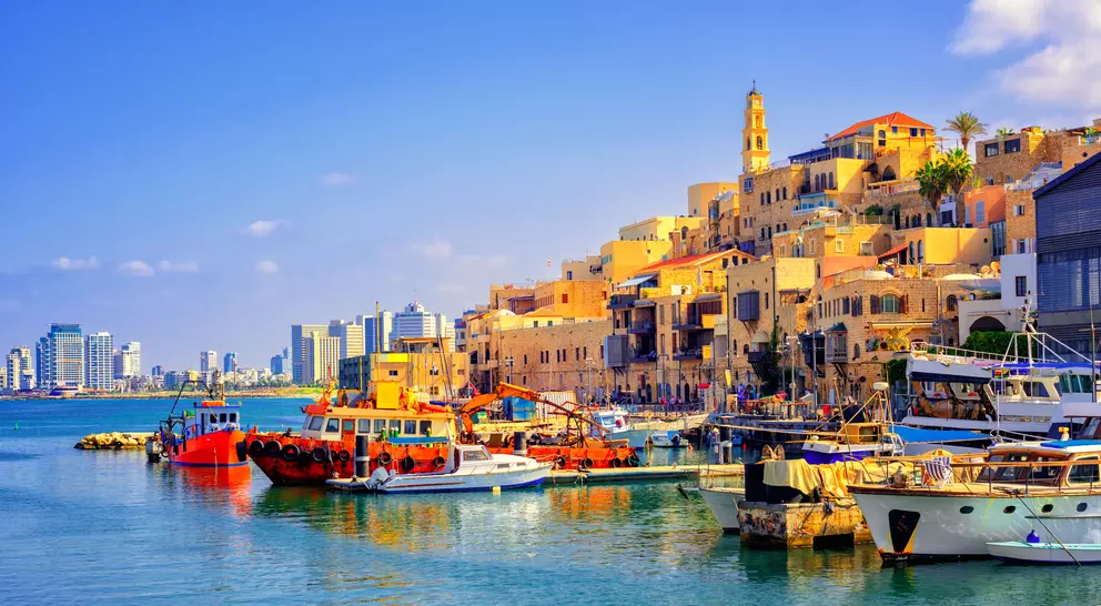 Old town and port of Jaffa and modern skyline of Tel Aviv city
