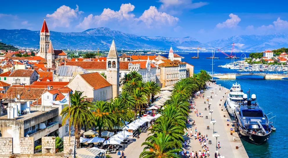 Sunny promenade along the pier of old Venetian town, Dalmatian Coast.